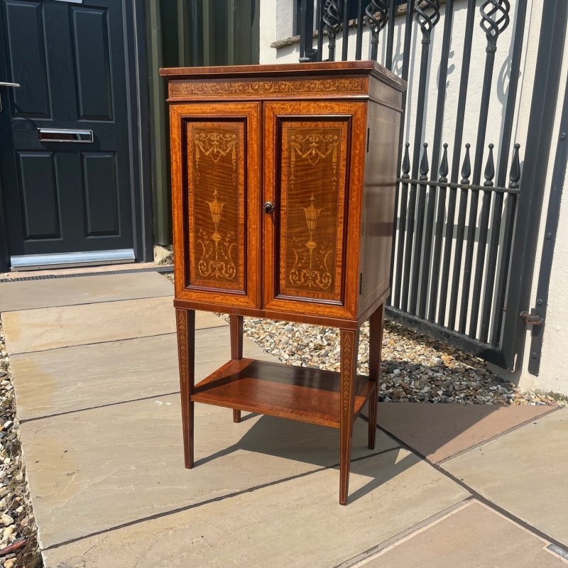 A Fine Quality Edwards and Roberts Of London marquetry inlaid music cabinet